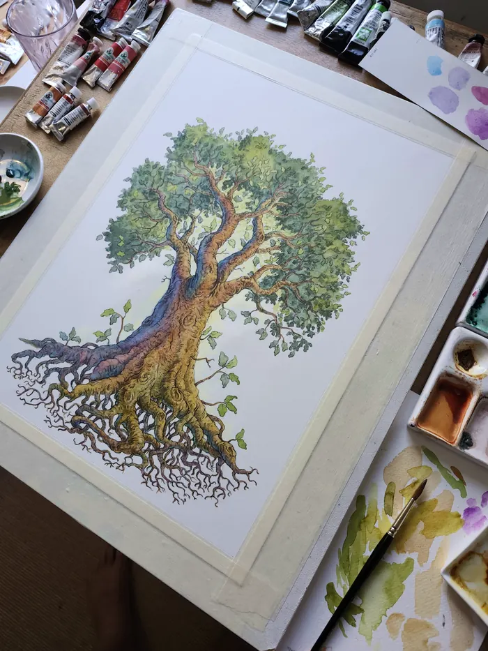 The Life Tree in watercolour on the work table with paints and brushes
