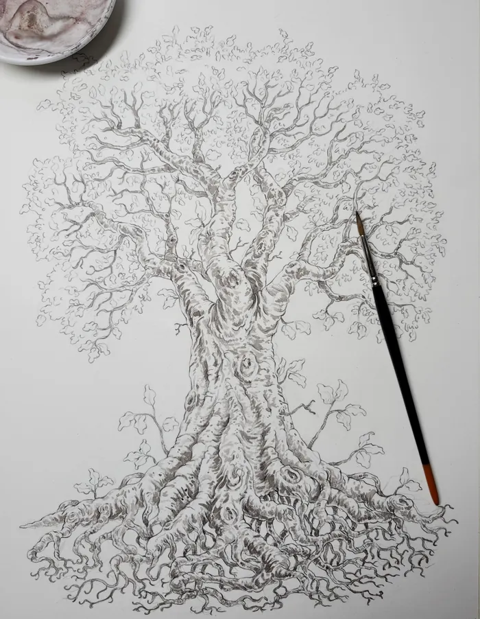 The pencil sketch of the Life Tree with a brush resting on the paper